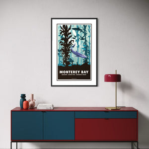 Framed Monterey Bay California coastal poster above a modern credenza