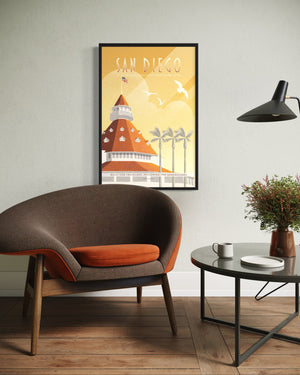 Framed San Diego Hotel del Coronado poster above modern lounge chair in mid-century inspired living space
