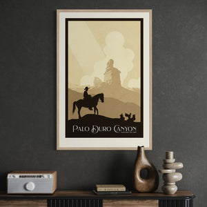 Framed Palo Duro Canyon cowboy art print displayed in a contemporary office, showcasing a vintage western landscape with a lone cowboy riding through the Texas canyon.