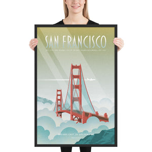 Product mockup of Illustrated travel poster featuring the Golden Gate Bridge rising out of soft blue and white fog, with sunlight streaking across a golden sky and a white jet flying above. The design has a retro, vintage texture and a mid-century modern style. Text reads “San Francisco” at the top and “Dreams Cast in Golden Fog” at the bottom.