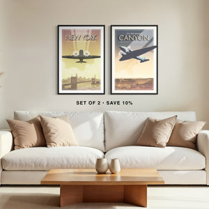 DC-3 New York City and Grand Canyon aviation art prints in black frames displayed as a gallery set above a modern white sofa