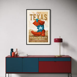 Framed Welcome to Texas cowboy boot poster displayed above a modern credenza in a stylish living room.