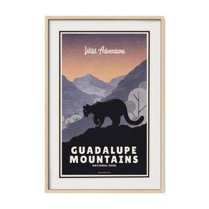 Guadalupe Mountains National Park poster displayed in a natural oak frame that complements the warm desert palette and vintage illustration.
