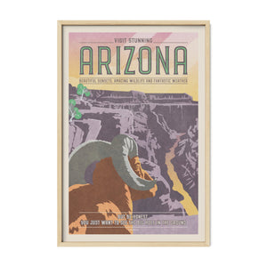 Grand Canyon vintage travel poster with bighorn sheep and Arizona canyon landscape in a natural oak frame.