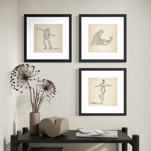 Music & Dance Gallery Set of 3 featuring original digital pen-and-ink sketches of Dancing Man No. 1, Dancing Man No. 2, and Piano Man, matted and framed in an asymmetrical arrangement above a console table.