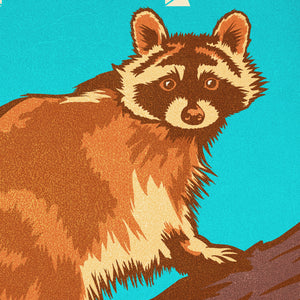 Close-up detail of The Rascally Raccoon poster showing vintage textures, bold colors, and wildlife illustration