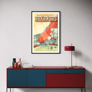 Framed Arkansas travel poster displayed in a modern living room above a credenza featuring an illustrated Ozark wilderness scene.