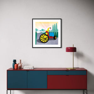 Big Wheel poster in black frame displayed above a modern living room credenza