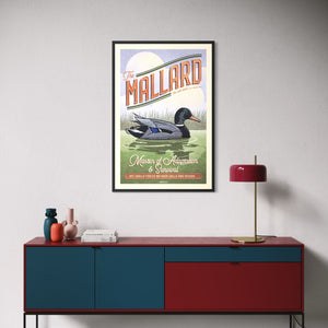 Framed Mallard duck poster displayed above a modern credenza in a contemporary living room.