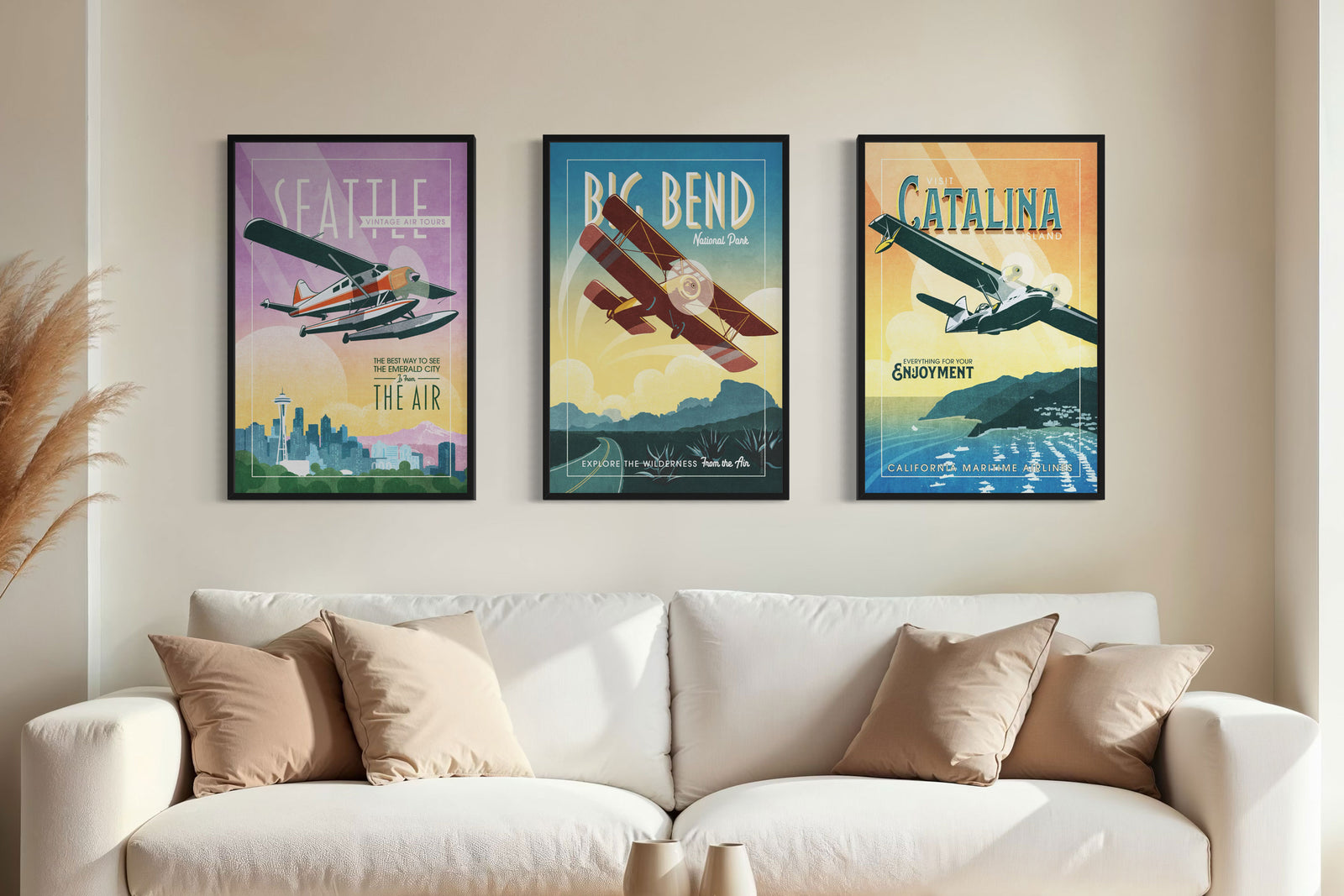 Mid century aviation wall art set of three in black frames above a sofa featuring vintage Seattle, Big Bend, and Catalina Island airplane posters