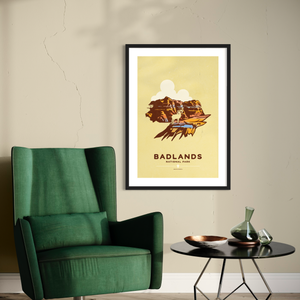 Modern, minimalist giclée art print for Badlands National Park in South Dakota. This simple and classy poster depicts a Bighorn sheep standing on top of one of the many unique geological formations that can be found throughout the park. It has the words “Badlands National Park, South Dakota”  at the bottom. The print’s muted overall background color allows the bold and vibrant colors of the main image to pop. 