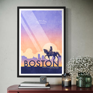 Boston George Washington Statue Travel Poster. In Boston you can walk in the footsteps of heroes like Washington himself. Bright and bold colors combined with a striking design create a stunning poster, which is sure to make a great addition to any room, with a headline that says “Visit Boston”.  At the top, the type says “Walk In The Footsteps of Heroes.” At the bottom, the type says “George Washington Statue — Boston’s Public Garden.”