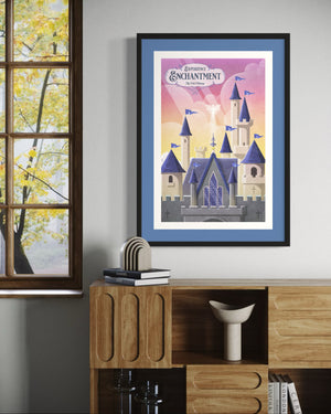 Castle poster print with blue matting, vintage fantasy wall art displayed beside window and wooden credenza with books.