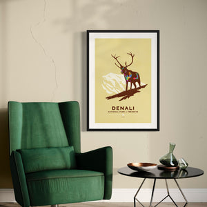 Modern, minimalist giclée art print of Denali National Park & Preserve in Alaska. This simple and classy poster depicts a Caribou standing on a hill top with the mountains in the background.  It has the words “Denali National Park & Preserve, Alaska”  at the bottom. The print’s muted overall background color allows the bold and vibrant colors of the main image to pop. 