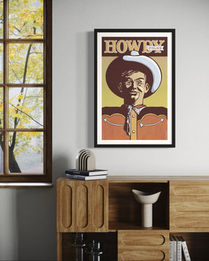 Illustrated poster print of a smiling cowboy in a large hat with the words “Howdy Folks” above, designed in a retro vintage style with warm textured tones.