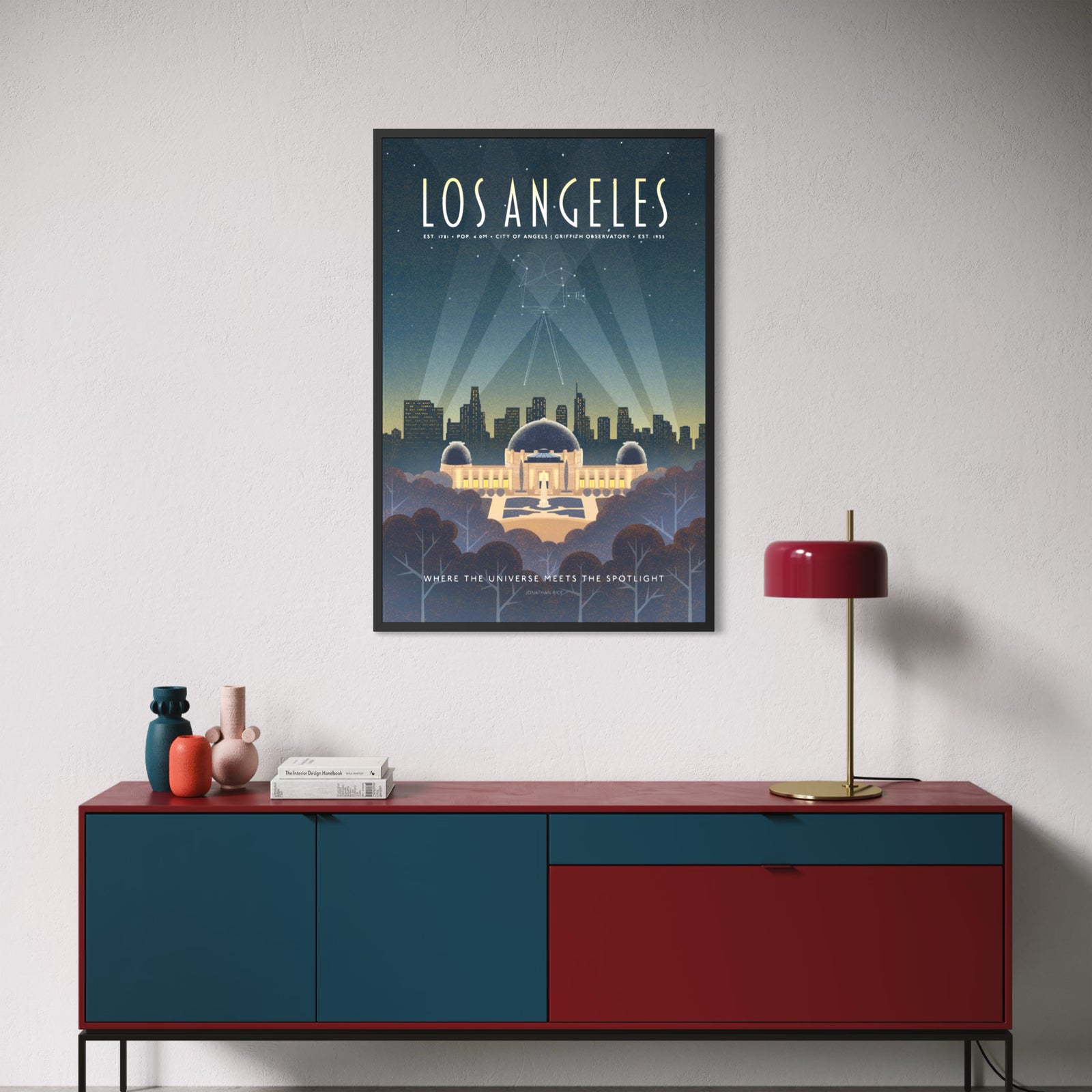 Illustrated Los Angeles travel poster showing Griffith Observatory at night with city skyline and a constellation forming a vintage movie camera in the sky. Retro Art Deco design with spotlights and starry sky.