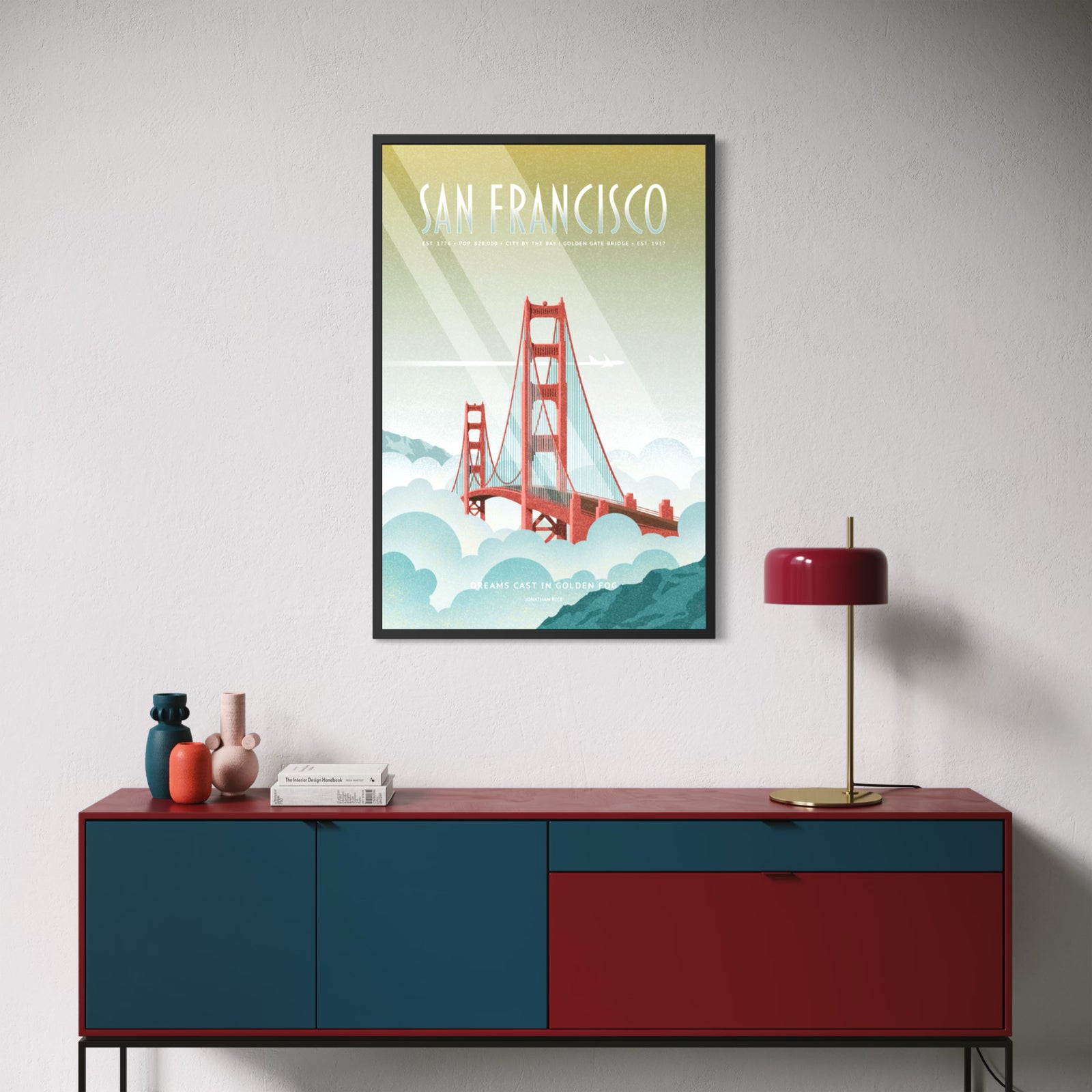 A vintage-style travel poster for San Francisco featuring the Golden Gate Bridge rising above clouds, with a pale green-to-blue gradient background and white text reading “SAN FRANCISCO” and “DREAMS CAST IN GOLDEN HOUR.”.