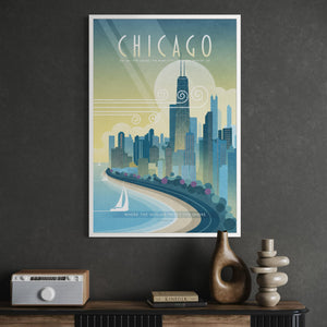 A framed Chicago travel poster with a retro-style cityscape illustration hangs on a dark gray wall above a console table with decorative objects.