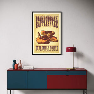 Black framed poster of a diamondback rattlesnake above a modern credenza in living room