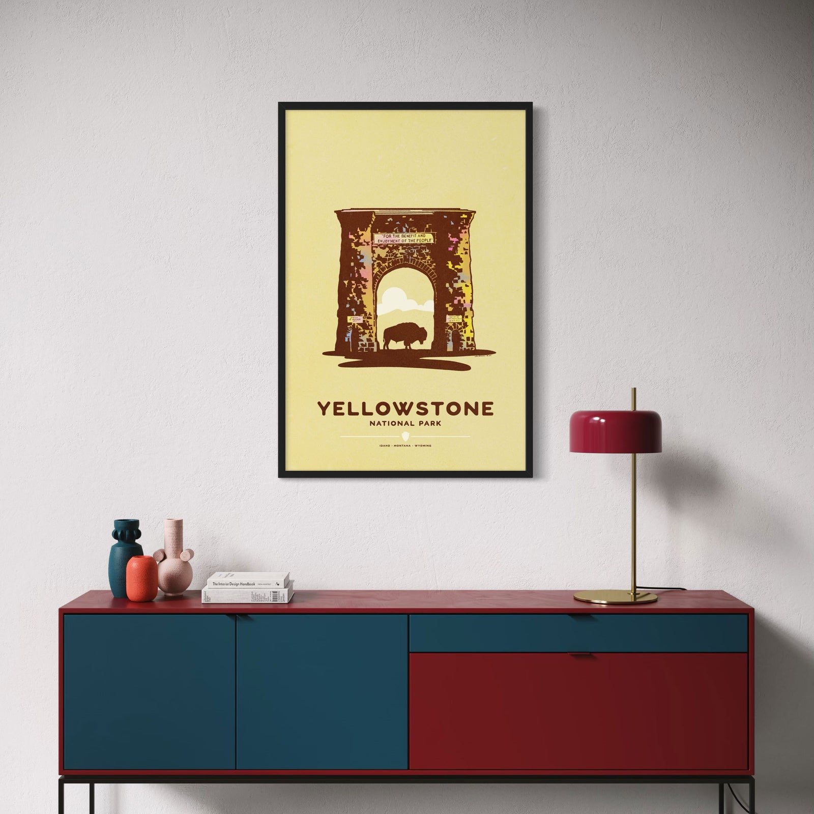 A minimalist Yellowstone National Park travel poster featuring Roosevelt Arch illustration with a bison silhouette and the text 'YELLOWSTONE NATIONAL PARK' on a pale yellow background.