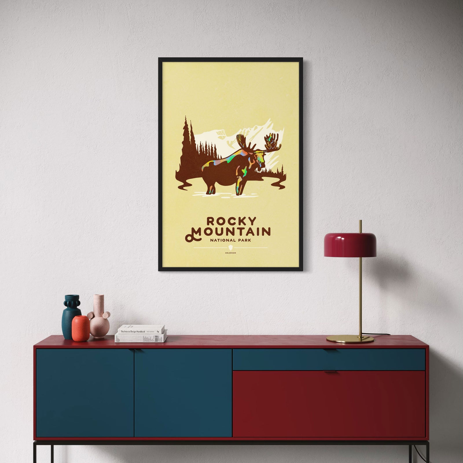Rocky Mountain National Park poster featuring moose with mountains and forest in bold graphic style