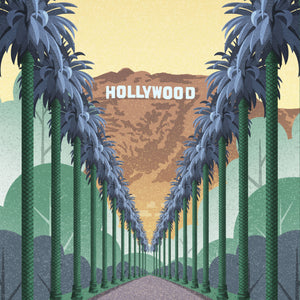 Zoomed-in view of palm trees leading toward the Hollywood Hills and sign in warm sunset tones.