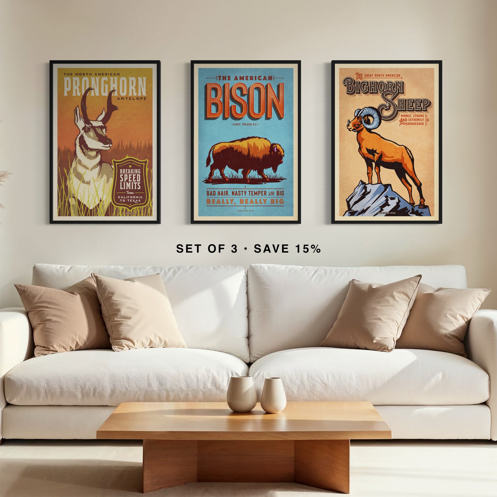 Set of three vintage-style Western animal posters featuring pronghorn, bison, and bighorn sheep displayed above a living room sofa