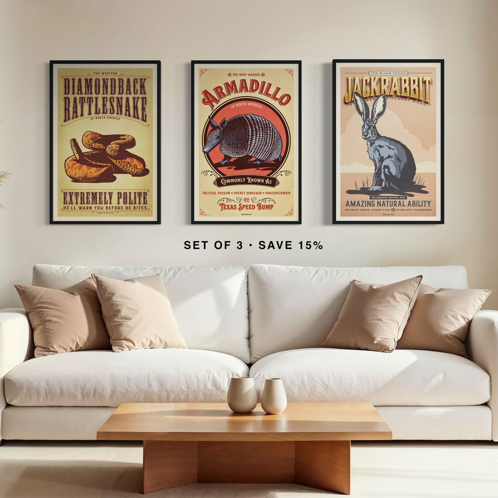 Three framed vintage animal posters displayed above a sofa in a living room interior