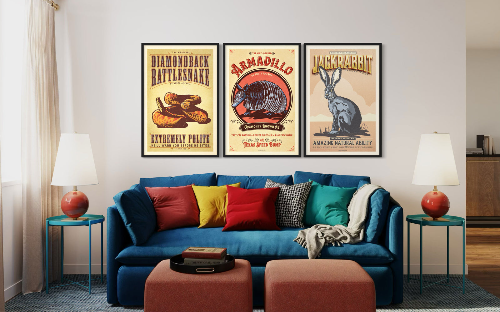 Three framed vintage animal posters displayed above a sofa in a living room interior