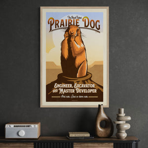 Prairie Dog illustrated poster in oak wood frame with vintage-inspired typography and warm earth tones over a vintage cabinet.