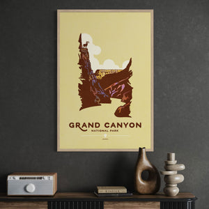 Framed WPA-style Grand Canyon wall art with desert canyon landscape in a mid-century modern interior