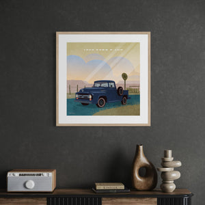 1956 Ford F-100 vintage truck poster displayed in a modern office with a natural oak frame.