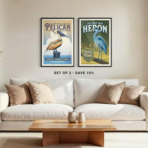 Brown Pelican and Blue Heron gallery wall art set of two framed above a couch