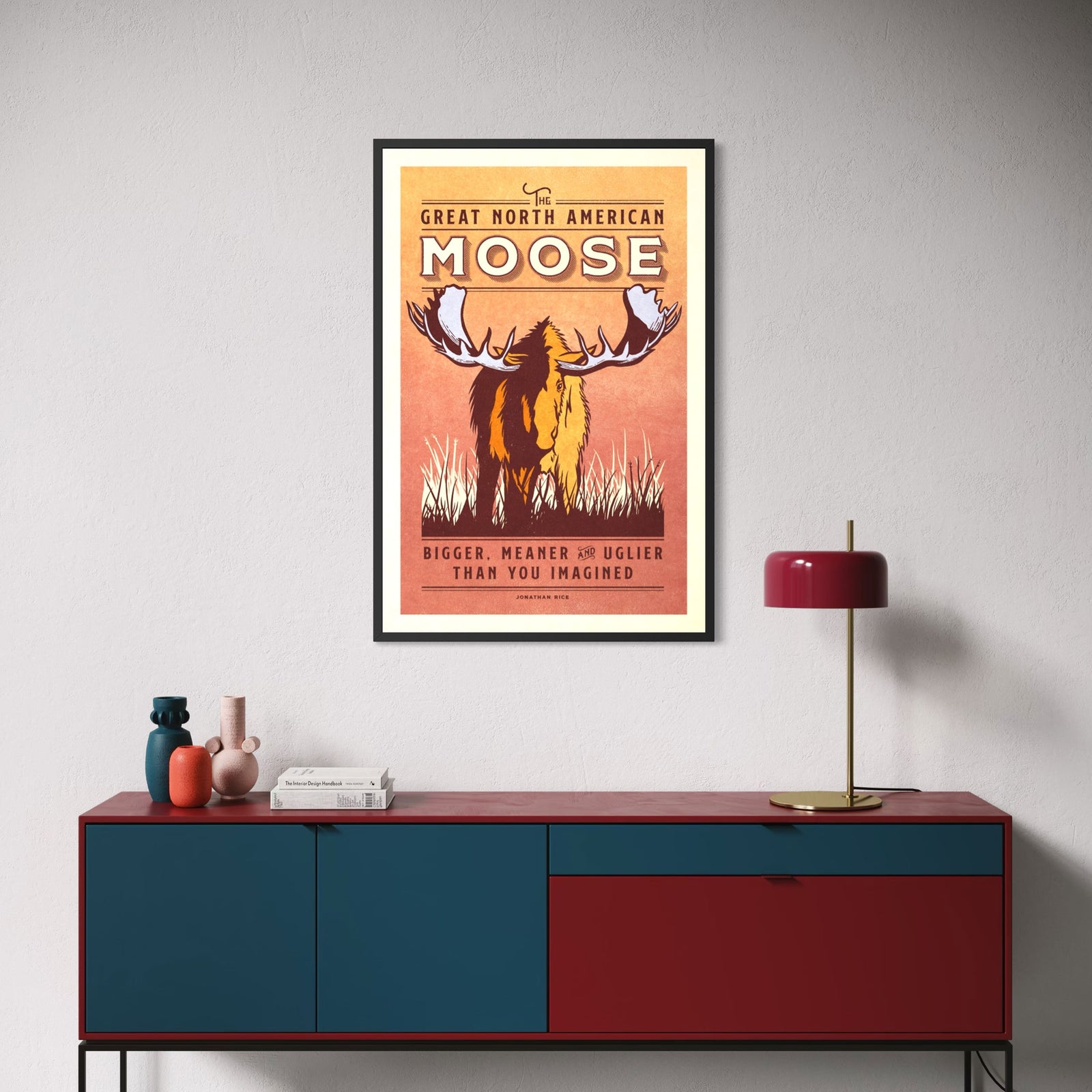 Vintage moose wildlife poster featuring a large North American bull moose with oversized antlers and the humorous slogan “Bigger, Meaner and Uglier Than You Imagined.”