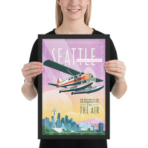 Retro style giclée art print of a De Havilland Canada DHC-2 Beaver floatplane flying over Seattle, Washington.. It has the words “Seattle Vintage Air Tours” at the top. The print’s soft purples, yellows, blues and greens create a stunning backdrop for the classic floatplane with it’s touch of red. There are additional words a the bottom that says “The best way to see the Emerald City is from the air.” Framed size 12" x 18"