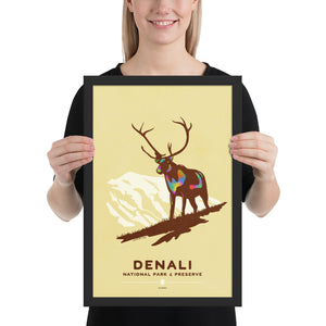 Modern, minimalist giclée art print of Denali National Park & Preserve in Alaska. This simple and classy poster depicts a Caribou standing on a hill top with the mountains in the background.  It has the words “Denali National Park & Preserve, Alaska”  at the bottom. The print’s muted overall background color allows the bold and vibrant colors of the main image to pop. 