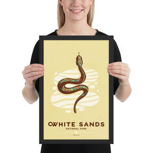 Modern, minimalist giclée art print of White Sands National Park & Preserve in Alaska. This simple and classy poster depicts a Diamondback Rattlesnake slithering across the white sands of the park. It has the words “White Sands National Park, New Mexico”  at the bottom. The print’s muted overall background color allows the bold and vibrant colors of the main image to pop. 