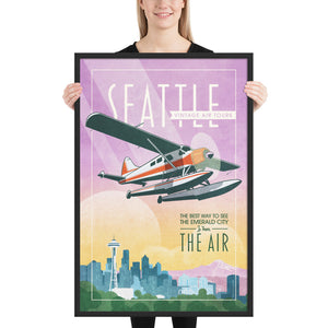 Retro style giclée art print of a De Havilland Canada DHC-2 Beaver floatplane flying over Seattle, Washington.. It has the words “Seattle Vintage Air Tours” at the top. The print’s soft purples, yellows, blues and greens create a stunning backdrop for the classic floatplane with it’s touch of red. There are additional words a the bottom that says “The best way to see the Emerald City is from the air.” Framed size 24" x 36"