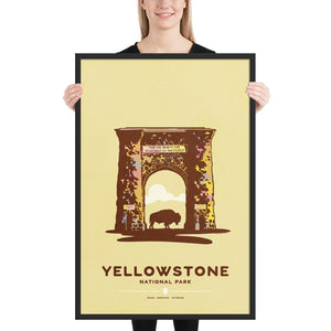 Modern, minimalist giclée art print for Yellowstone National Park in Idaho, Montana and Wyoming. The poster depicts the historic Roosevelt Arch—a gateway to Yellowstone—with a bison standing in the middle of it. It has the words “Yellowstone National Park”  and “Idaho, Montana, Wyoming” at the bottom. The print’s muted overall background color allows the bold and vibrant colors of the main image to pop. Framed print size 24" x 36"