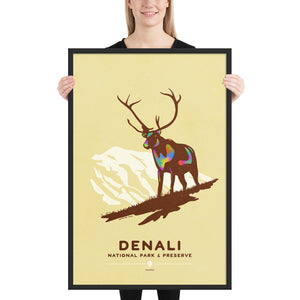 Modern, minimalist giclée art print of Denali National Park & Preserve in Alaska. This simple and classy poster depicts a Caribou standing on a hill top with the mountains in the background.  It has the words “Denali National Park & Preserve, Alaska”  at the bottom. The print’s muted overall background color allows the bold and vibrant colors of the main image to pop. 