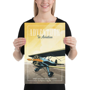 Retro style giclée art print of a modified WACO Biplane ready for takeoff. It has the words “Adventure in Aviaton” at the top. The print’s dusty yellow sunrise colors combined with bright blues and orange of the plane makes for a stunning image. There are additional words a the bottom that says “Sport biplanes for free spirits. Go Anywhere, Any Time.” Print size 12" x 18"