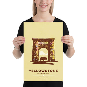 Modern, minimalist giclée art print for Yellowstone National Park in Idaho, Montana and Wyoming. The poster depicts the historic Roosevelt Arch—a gateway to Yellowstone—with a bison standing in the middle of it. It has the words “Yellowstone National Park”  and “Idaho, Montana, Wyoming” at the bottom. The print’s muted overall background color allows the bold and vibrant colors of the main image to pop.  Print size 12" x 18"