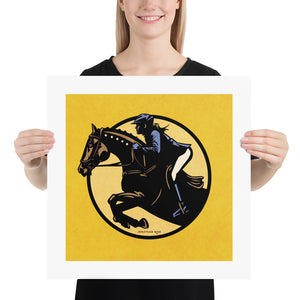Minimalist jumping equestrian art print captures the excitement of English riding events with its’ bold colors and simple, strong lines. It is a square pint with an image of a horse and rider jumping through a graphic circle. Yellow background.