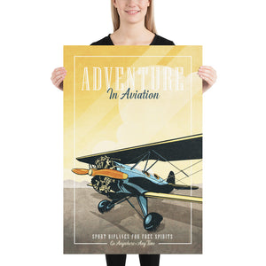 Retro style giclée art print of a modified WACO Biplane ready for takeoff. It has the words “Adventure in Aviaton” at the top. The print’s dusty yellow sunrise colors combined with bright blues and orange of the plane makes for a stunning image. There are additional words a the bottom that says “Sport biplanes for free spirits. Go Anywhere, Any Time.” Print size: 24" x 36"