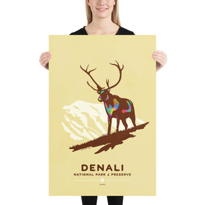 Modern, minimalist giclée art print of Denali National Park & Preserve in Alaska. This simple and classy poster depicts a Caribou standing on a hill top with the mountains in the background.  It has the words “Denali National Park & Preserve, Alaska”  at the bottom. The print’s muted overall background color allows the bold and vibrant colors of the main image to pop. 