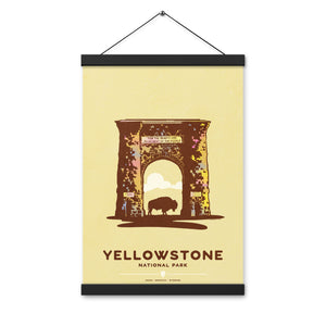 Modern, minimalist giclée art print for Yellowstone National Park in Idaho, Montana and Wyoming. The poster depicts the historic Roosevelt Arch—a gateway to Yellowstone—with a bison standing in the middle of it. It has the words “Yellowstone National Park”  and “Idaho, Montana, Wyoming” at the bottom. The print’s muted overall background color allows the bold and vibrant colors of the main image to pop. Print with hanger size 12" x 18"
