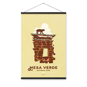 Modern, minimalist giclée art print for Mesa Verde National Park in Colorado. This simple and classy poster depicts a section of the ruins of Mesa Verde with a bobcat walking across the top of it.  It has the words “Mesa Verde National Park, Colorado” at the bottom. The print’s muted overall background color allows the bold and vibrant colors of the main image to pop. Print with hange size 24" x 36"