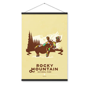 Modern, minimalist giclée art print for Rocky Mountain  National Park in South Dakota. This simple and classy poster depicts a moose standing in a lake with forest and mountains in the background.  It has the words “Rocky Mountain National Park, Colorado”  at the bottom. 