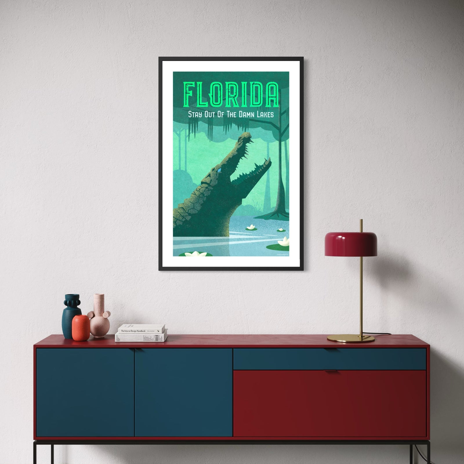 Florida alligator poster featuring a large alligator rising from a swamp with “Stay Out of the Damn Lakes” typography