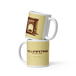 Coffee mug with an image of the historic Roosevelt Arch—a gateway to Yellowstone—with a bison standing in the middle of the entry on one side and the words “Yellowstone National Park, Idaho, Montana and Wyoming” on the other.